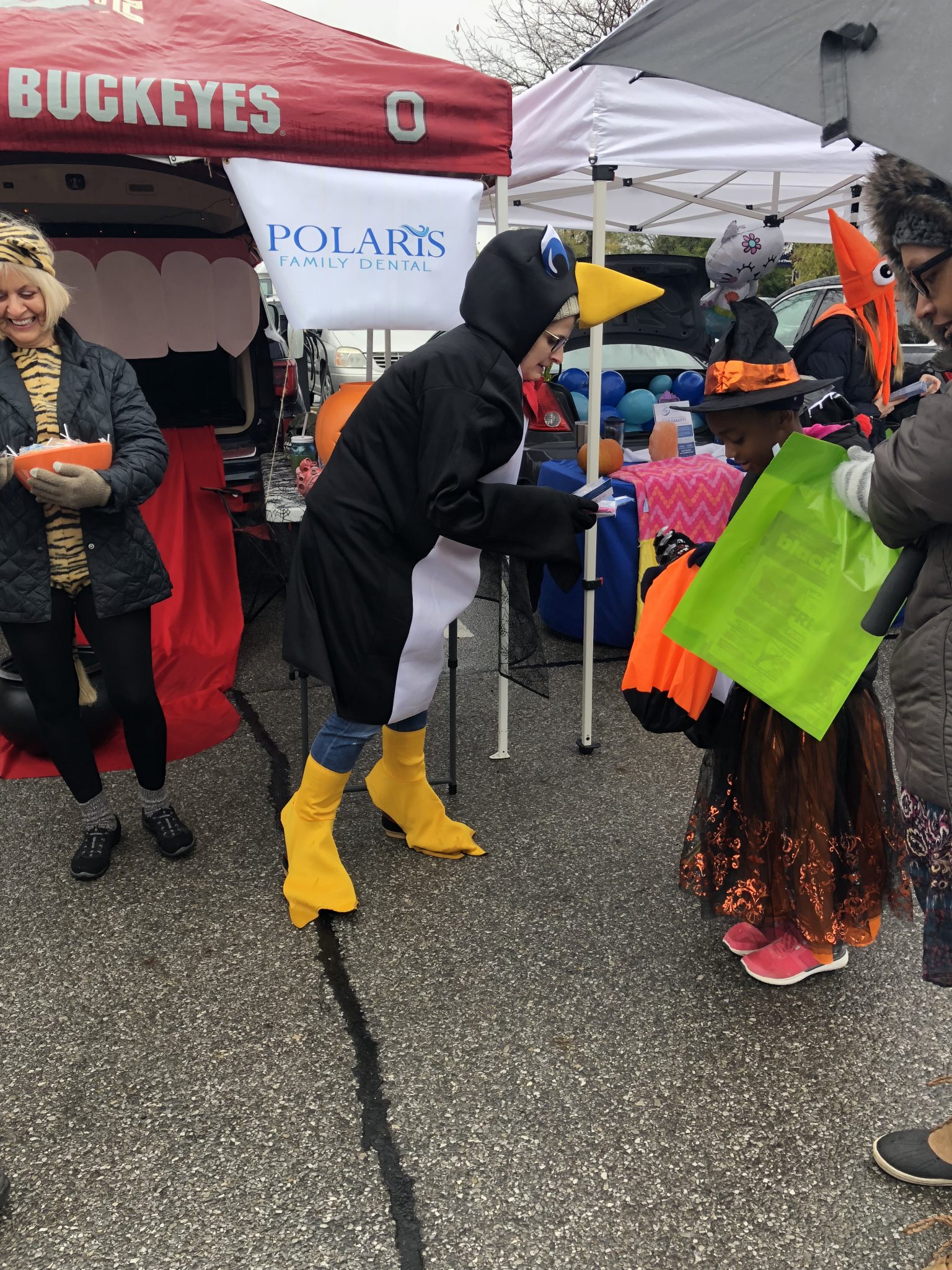 Handing Out Candy Dressed Up as Penguin